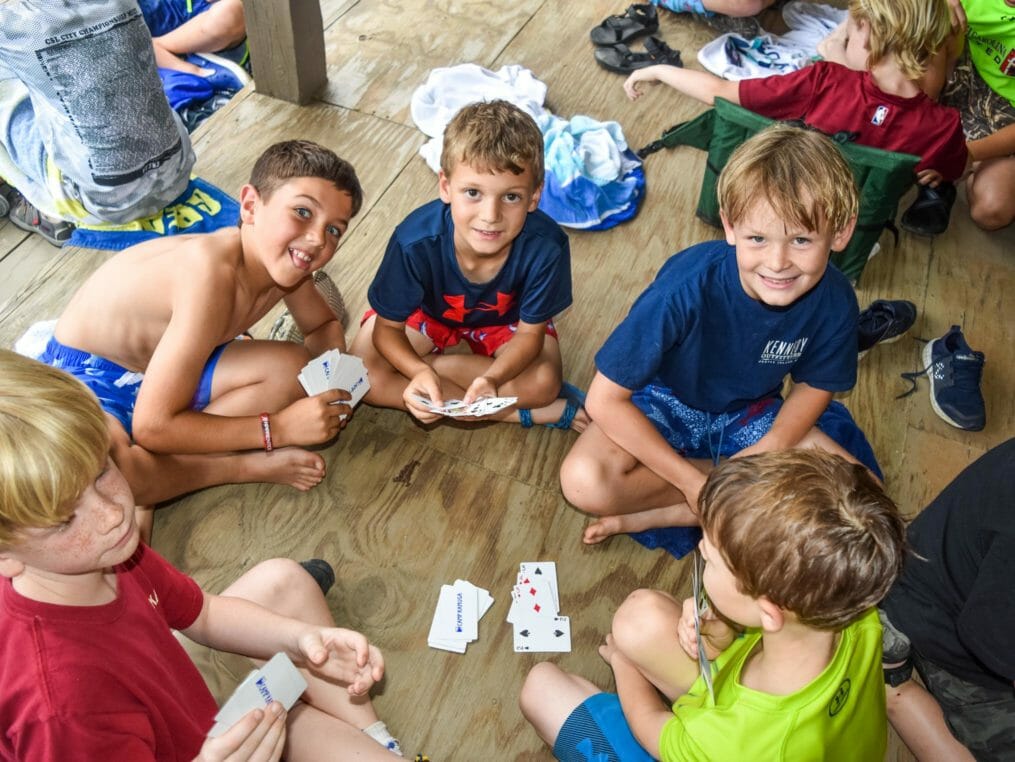 Boys playing cards in the cabin