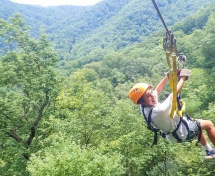 Camper zip lining at the Hendersonville Adventure Day Camp