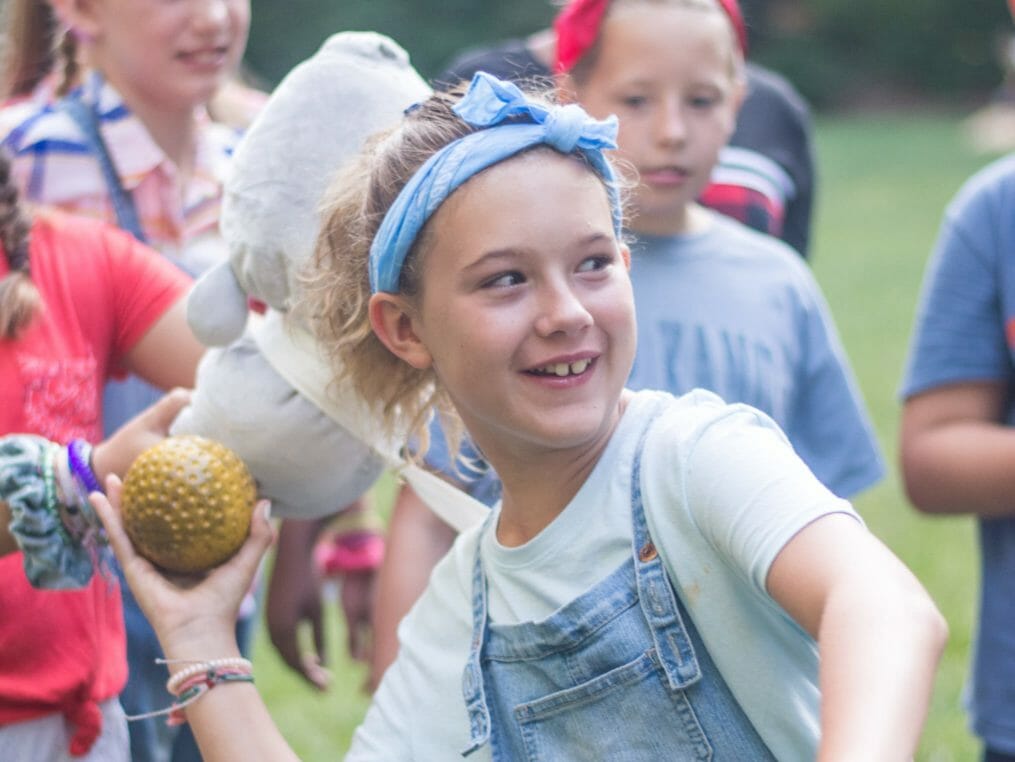 Girl throwing a ball for field games