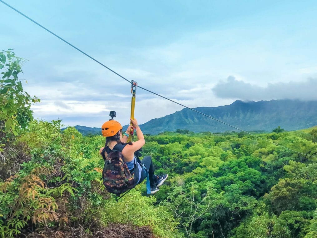 Camper on a zip line in Hawaii