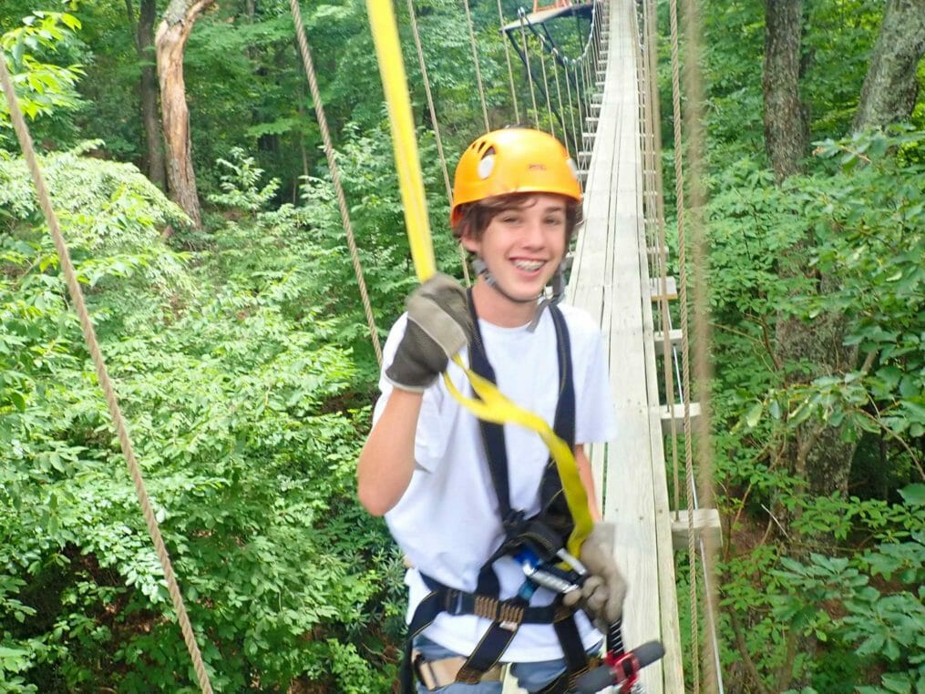 Camper on the ropes course at the Hendersonville Adventure Day Camp