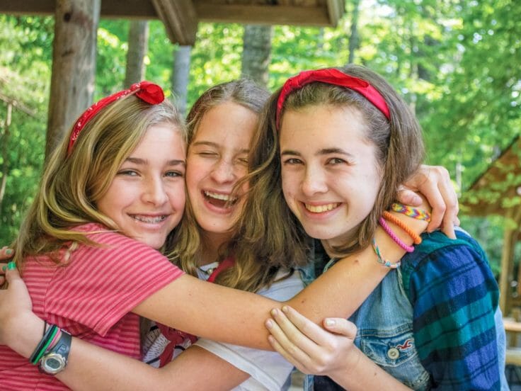 three girls hugging