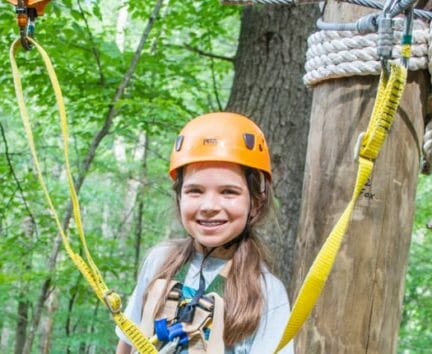 Female camper about to zip line