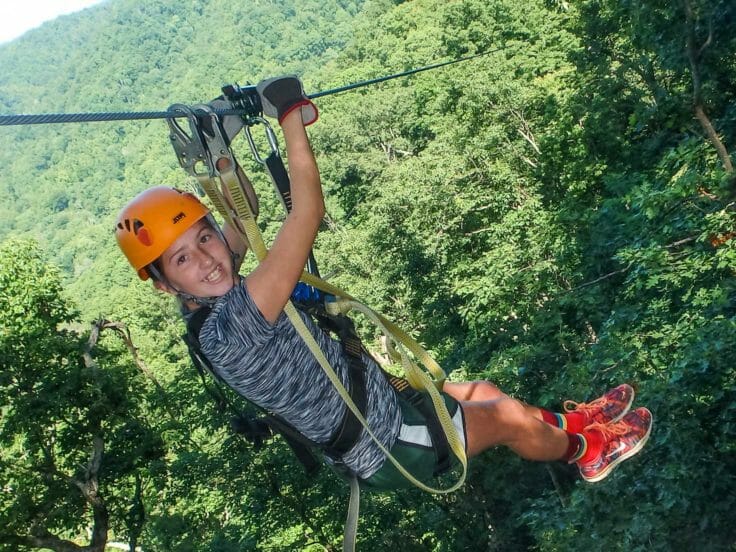 Camper zip lining at the Hendersonville Adventure Day Camp