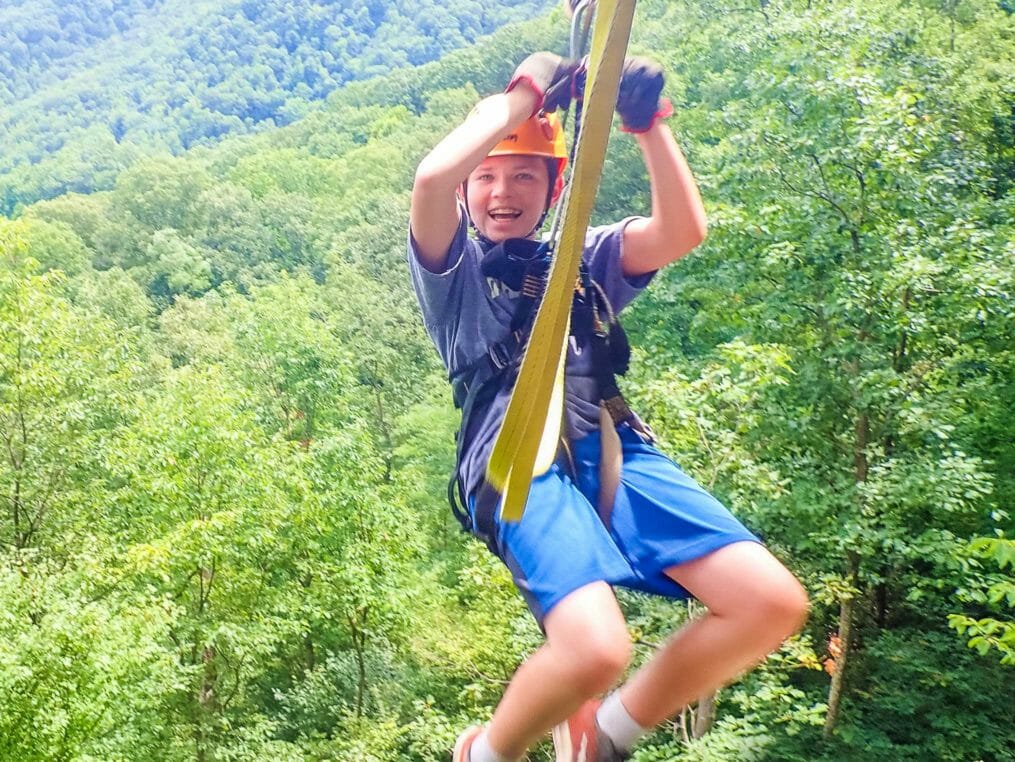 Boy on the zip line smiling