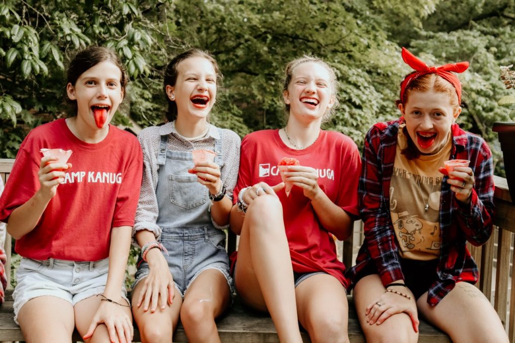 Smiling campers with icecream.